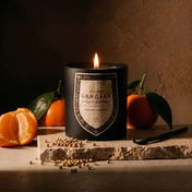 Mandarin Coriander candle label close-up, lit — Atelier Candela